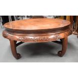 A VERY UNUSUAL 19TH CENTURY CHINESE HARDWOOD CIRCULAR LOW TABLE Qing, possibly Huanghuali, with curv