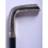 A 19TH CENTURY RUSSIAN SILVER MOUNTED WALKING CANE with niello style inlay. 86 cm long.