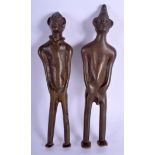 A PAIR OF AFRICAN BRONZE BENIN STYLE TRIBAL FIGURES. 25 cm high.