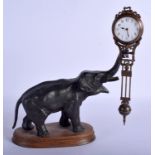 A RARE ANTIQUE EUROPEAN BRONZE ELEPHANT MYSTERY CLOCK modelled upon an oak plinth. Elephant 21 cm x