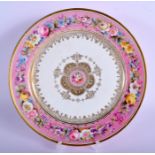 Sevres plate painted with flowers on a pink border, the centre highly gilt with a central floral med