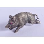 A SMALL CONTINENTAL SILVER HOG with ruby eyes. 16 grams. 3 cm x 0.5 cm.