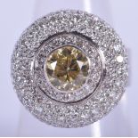 A GOOD 18CT GOLD AND FANCY YELLOW DIAMOND CLUSTER RING the central stone approx 1.5 cts. O. 17.3 gra