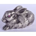 A LARGE CONTINENTAL SILVER FIGURE OF A RABBIT with ruby eyes. 107 grams. 10 cm x 7 cm.