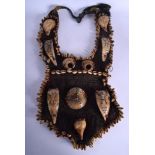 AN UNUSUAL EARLY 20TH CENTURY AFRICAN TRIBAL SHELL APRON decorated with figures. 60 cm x 25 cm.