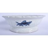 A CHINESE BLUE AND WHITE SCALLOPED PEDESTAL DISH 20th Century, painted with fish and enamelled folia