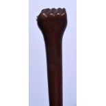 A 19TH CENTURY CONTINENTAL CARVED WOOD SAILORS FIST WALKING CANE. 88 cm long.