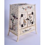 A 19TH CENTURY JAPANESE MEIJI PERIOD CARVED IVORY KODANSU CABINET decorated with shibayama inlaid do