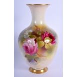 Royal Worcester vase of baluster shape painted with roses by R. Austin date code 1923. 19.5cm high
