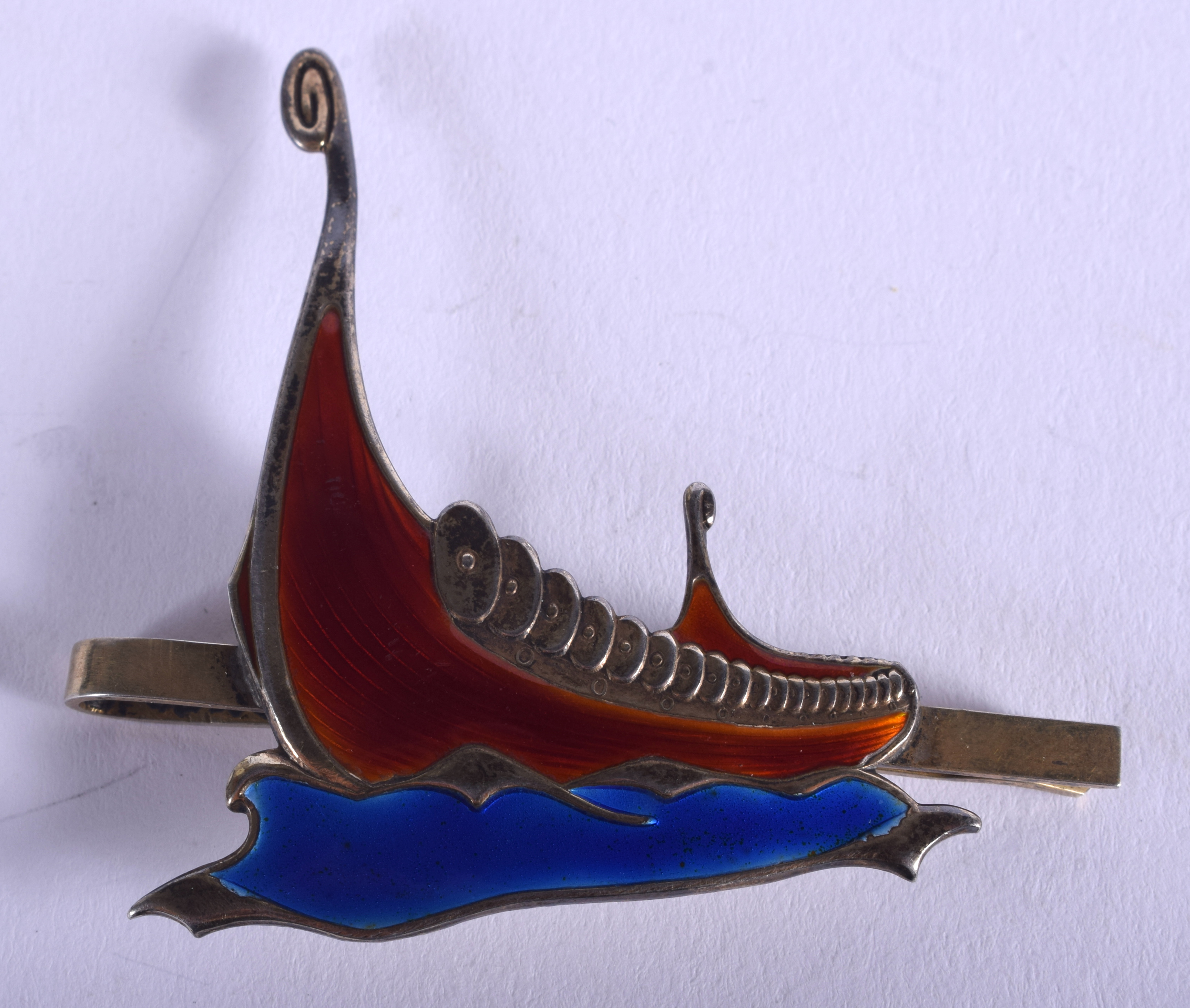 A NORWEGIAN SILVER AND ENAMEL VIKING BOAT BROOCH. 11.3 grams. 6 cm x 5.5 cm.