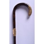 AN ANTIQUE EUROPEAN YELLOW METAL MOUNTED WALKING CANE probably 9ct gold. 95 cm long.