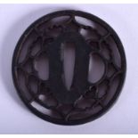 AN 18TH CENTURY JAPANESE EDO PERIOD IRON TSUBA of sharp quality, decorated with heart and cloud moti