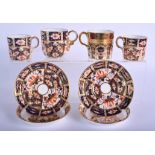 Royal Crown Derby imari patterns: a pair of coffee cans and saucers pattern 2451, a similar coffee c