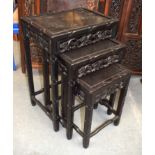 A NEST OF THREE EARLY 20TH CENTURY CHINESE HARDWOOD TABLES. Largest 60 cm x 45 cm. (3)