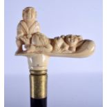 A NOVELTY CONTINENTAL CARVED BONE HANDLED EROTIC WALKING CANE. 84 cm long.