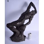 A VERY LARGE CONTEMPORARY BRONZE SCULPTURE OF A RECLINING MALE modelled upon a rocky outcrop. 60 cm