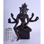 A GOOD 19TH CENTURY CHINESE NEPALESE INDIAN BRONZE FIGURE OF A DEITY modelled holding stupa and othe