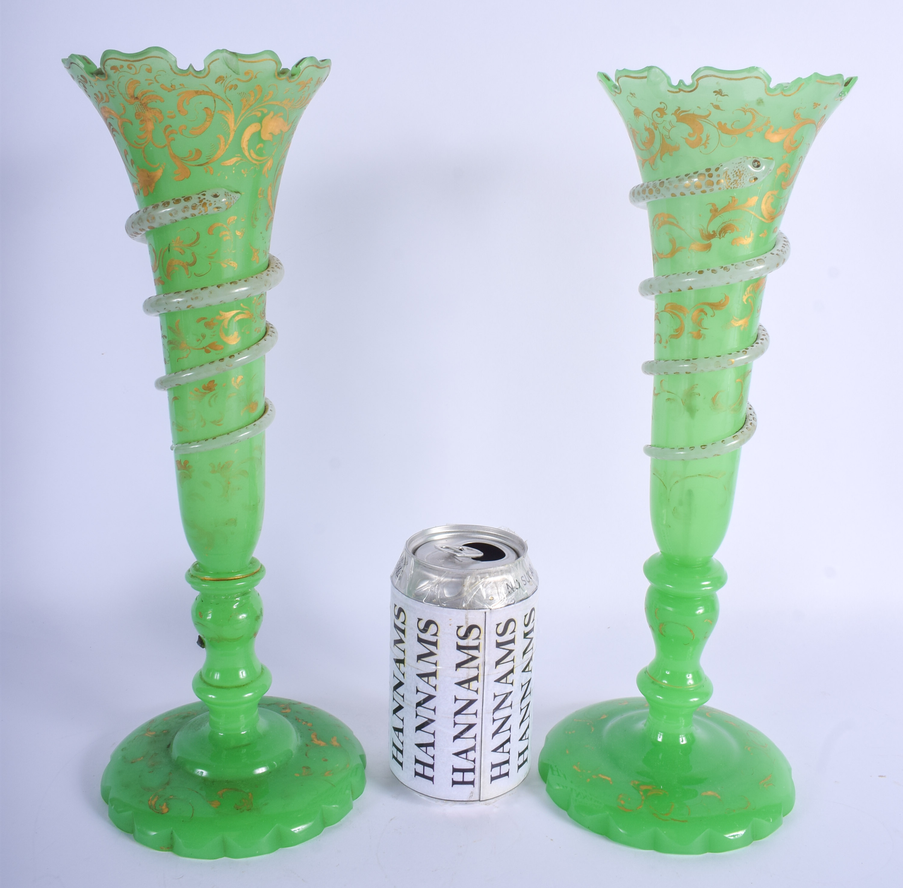 A RARE PAIR OF 19TH CENTURY BOHEMIAN SNAKE GLASS VASES painted with gilt scrolls. 32 cm high.