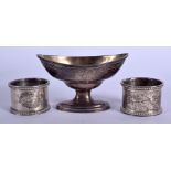 A GEORGE III SILVER SALT London 1796 & two silver napkin rings Sheffield 1903 & 1906. 170 grams. (3)