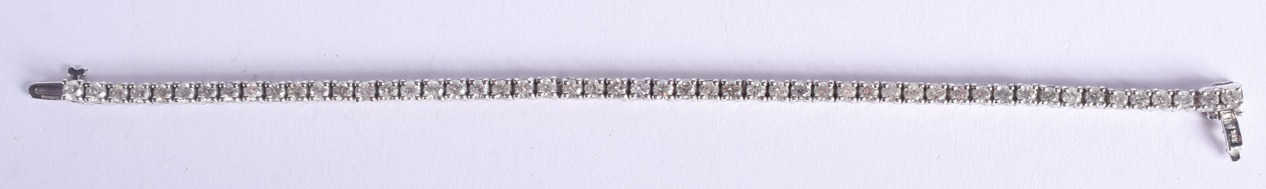 A FINE 18CT GOLD AND DIAMOND TENNIS BRACELET. 15.2 grams. 18 cm x 0.4 cm.