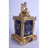 A MID 19TH CENTURY FRENCH ORMOLU LIMOGES ENAMEL MANTEL CLOCK painted with putti and foliage. 30 cm h