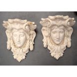 A PAIR OF ART NOUVEAU TYPE GARDEN WALL BRACKETS modelled as neo classical maidens. 41 cm x 35 cm.