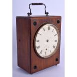 AN ANTIQUE OAK CASED PIGEON RACING CLOCK. 20 cm high inc handle.