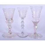 THREE 18TH CENTURY CONTINENTAL WINE GLASSES with engraved cartouches. Largest 18 cm high. (3)