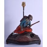 AN ANTIQUE SPELTER SOLIDER LAMP modelled as a military male upon a wood base. 27 cm x 24 cm not inc