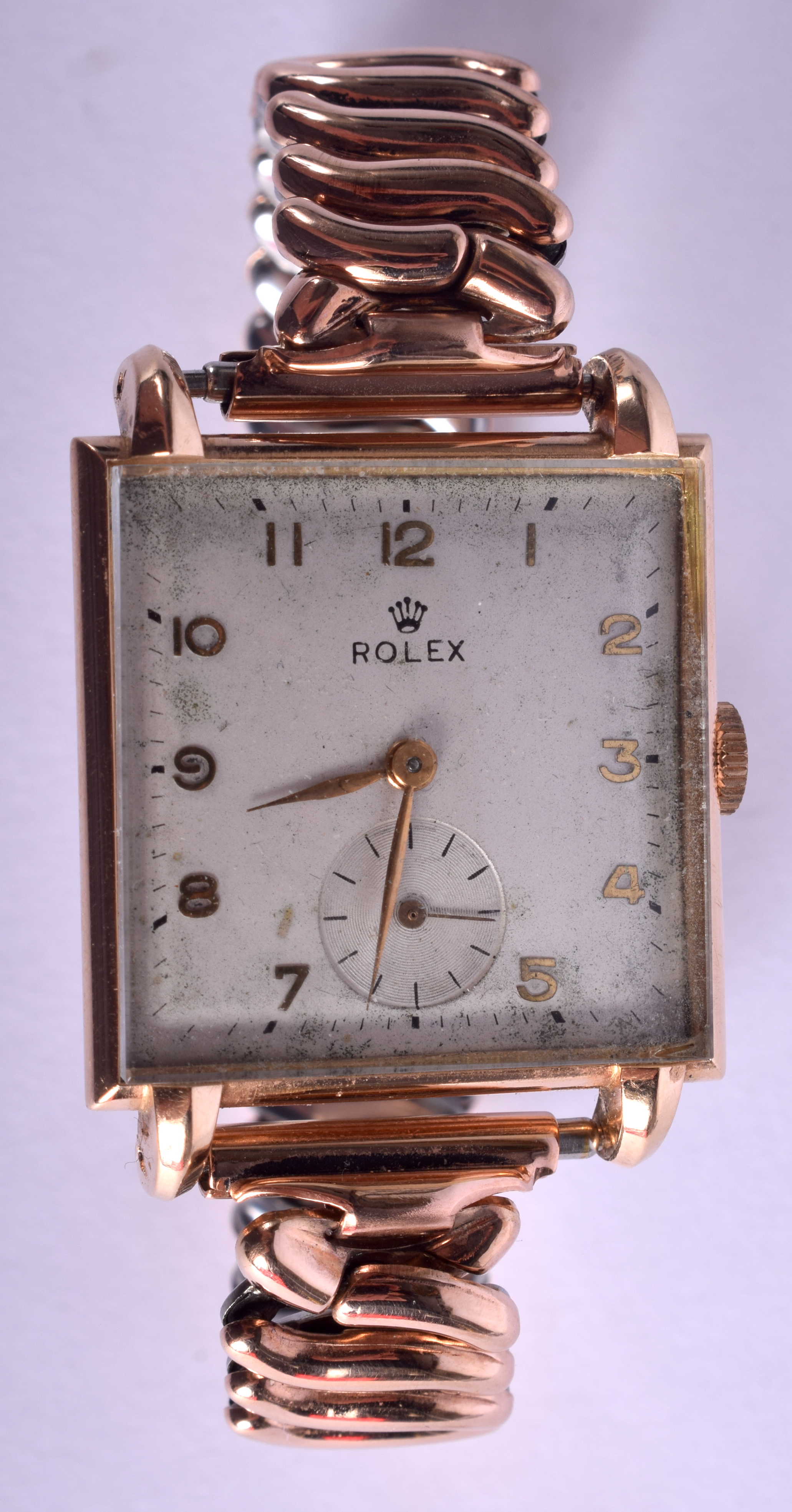 A VINTAGE 14CT GOLD ROLEX SQUARE FORM WRIST WATCH with yellow metal strap. 2.75 cm x 3.25 cm.