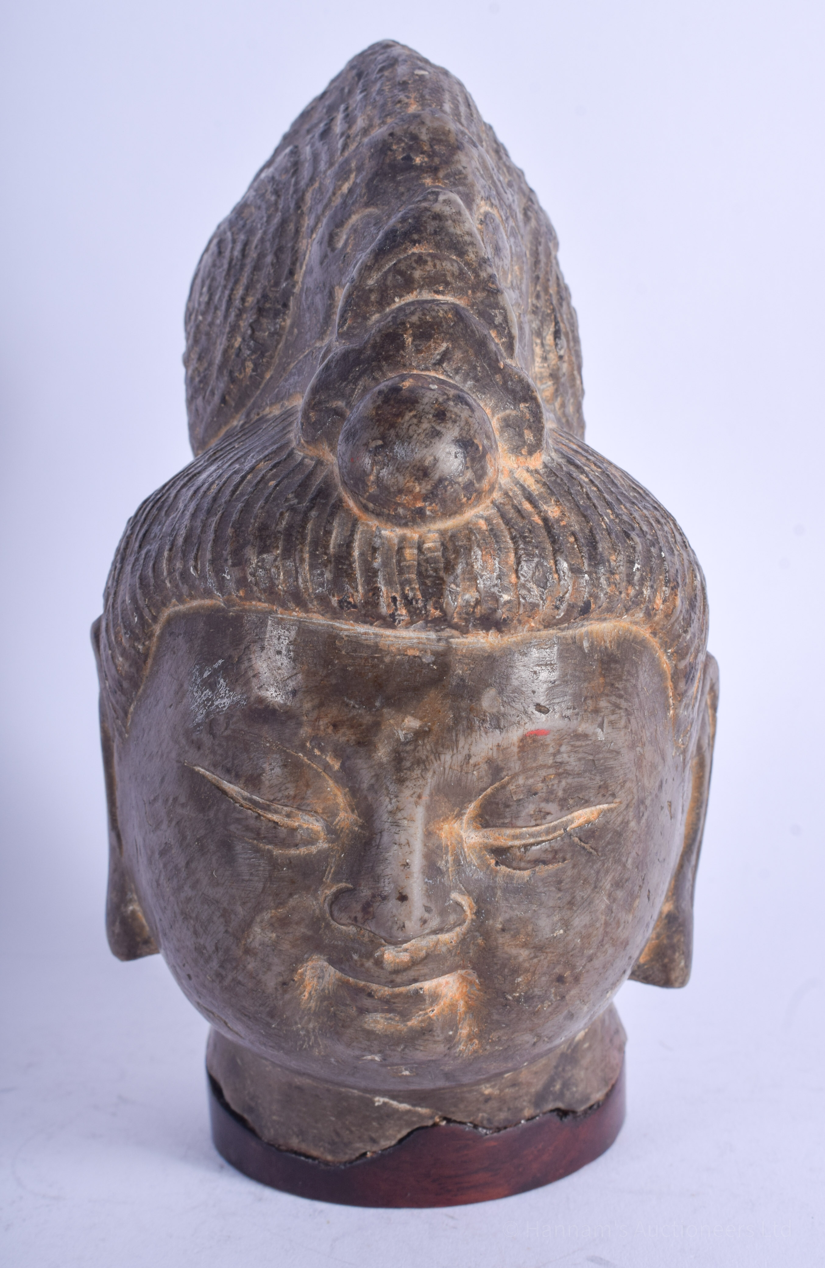 A RARE CHINESE TANG/SONG DYNASTY CARVED STONE HEAD OF A BUDDHIST DEITY elegantly modelled upon a fit