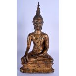 A 19TH CENTURY SOUTH EAST ASIAN THAI GILT BUDDHA modelled upon a triangular base. 30 cm x 12 cm.