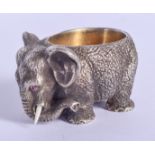 A CONTINENTAL SILVER ELEPHANT SALT with ruby eyes. 157 grams. 4.5 cm x 3 cm.