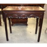 A 19TH CENTURY CHINESE HONGMU SCROLLING ALTAR TABLE Qing, decorated with a cloud style frieze. 90 cm