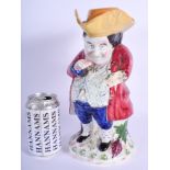 AN EARLY 19TH CENTURY BRITISH TOBY JUG AND COVER probably Scottish, modelled taking snuff . 30 cm hi