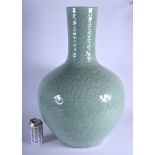 A LARGE 19TH CENTURY CHINESE CARVED TIAN QIU PING CELADON PORCELAIN VASE Qing, decorated with foliag