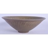 A CHINESE CELADON POTTERY BOWL 20th Century, decorated with boys and foliage. 18 cm diameter.