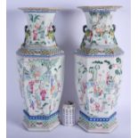 A LARGE PAIR OF LATE 19TH CENTURY CHINESE TWIN HANDLED FAMILLE ROSE VASES Qing, painted with figures