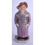 Royal Worcester figure of a man with a long coat, his hands in his pockets c. 1880. 14 cm high