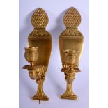 A PAIR OF 19TH CENTURY FRENCH EMPIRE BRONZE WALL SCONCES. 21 cm x 5 cm.