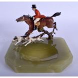 AN ART DECO COLD PAINTED BRONZE AND ONYX ASHTRAY modelled as a fox hunter. 19 cm x 16 cm.