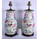 A LARGE PAIR OF 1960S CHINESE PORCELAIN VASES converted to lamps, painted with birds and foliage. Po