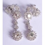 A PAIR OF 18CT WHITE GOLD AND DIAMOND DROP EARRINGS of approx 2.1 cts. 8.5 grams. 3.25 cm long.