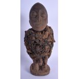 AN AFRICAN TRIBAL CARVED WOOD FERTILITY FIGURE modelled as a male with genitals exposed. 34 cm high.