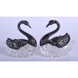 A PAIR OF SILVER AND CUT GLASS SWAN SALTS. 8 cm x 7 cm.