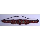 AN EARLY 20TH CENTURY CHINESE TIBETAN CORAL AMBER AND TURQUOISE BELT. 72 cm long.