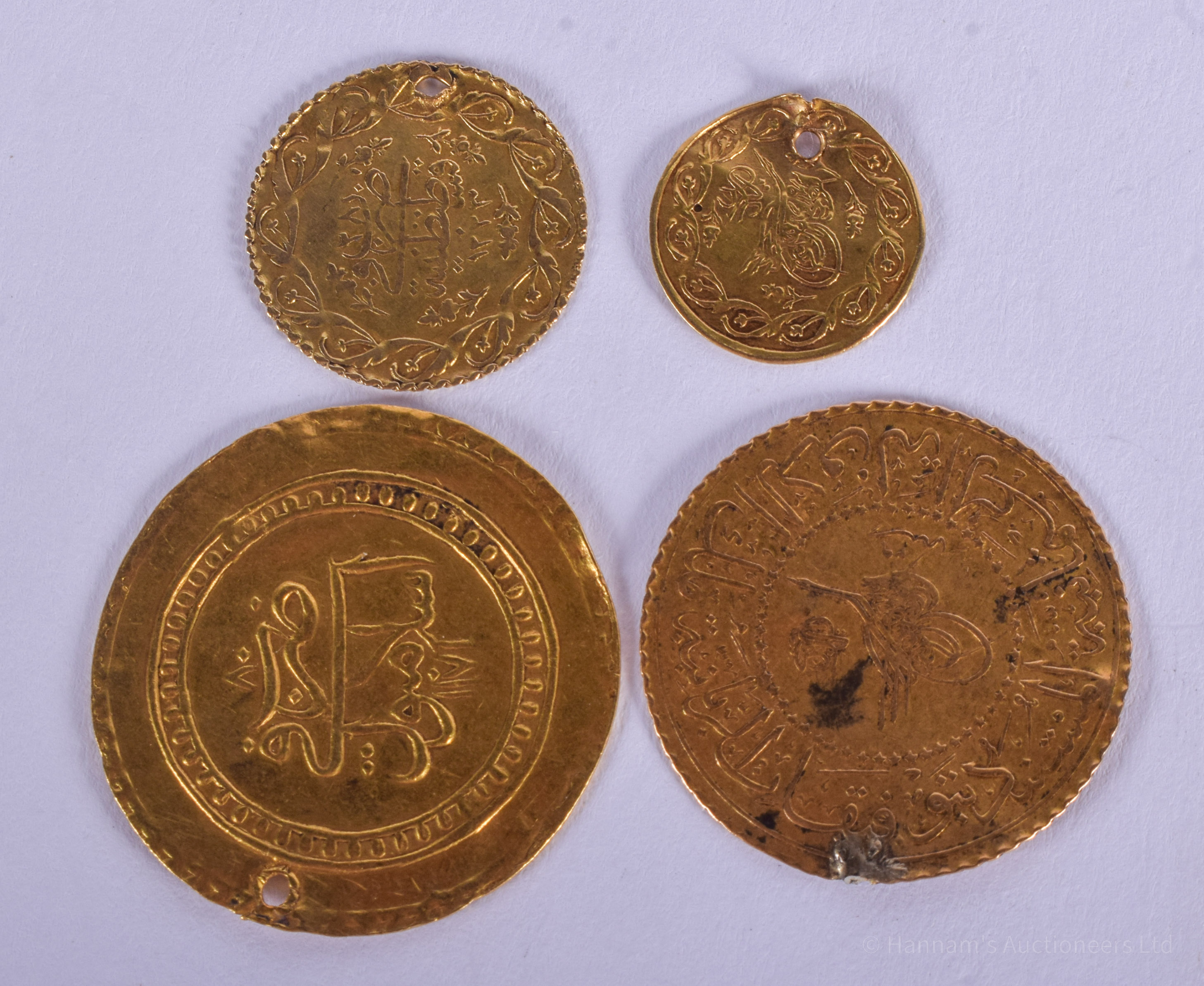 FOUR CONTINENTAL MIDDLE EASTERN GOLD COINS possibly 18th century. 10 grams. (4)