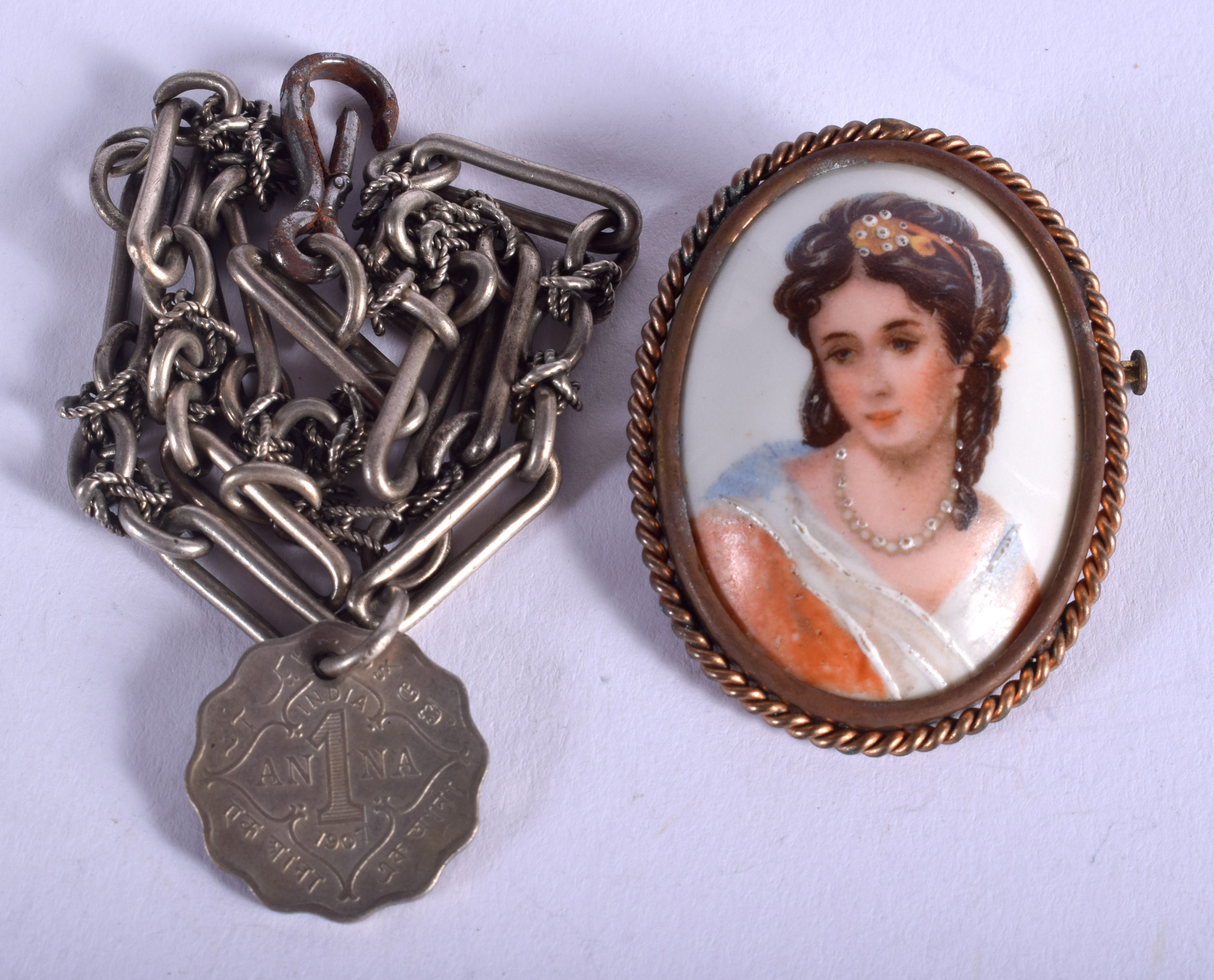 A SILVER BRACELET and brooch. (2)