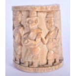 AN ANTIQUE AFRICAN TRIBAL YORUBA CARVED IVORY PLAQUE depicting figures roaming. 7 cm x 5 cm.