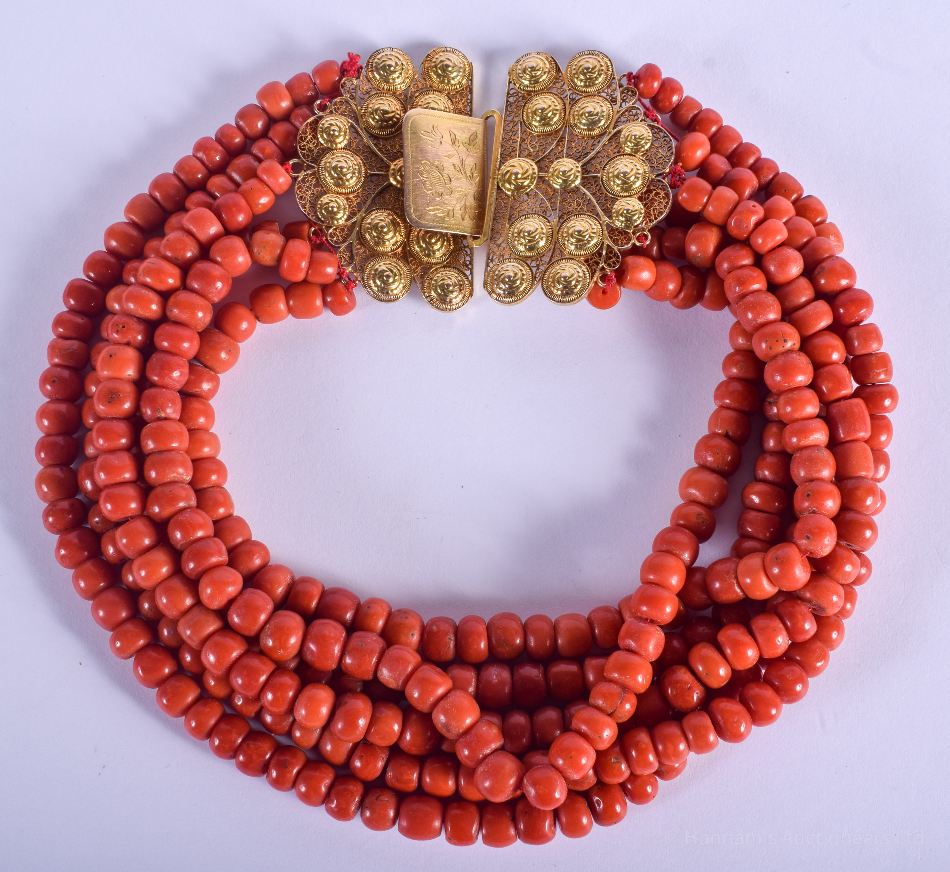 A LARGE 18CT GOLD RED CORAL NECKLACE. 310 grams. 40 cm wide.